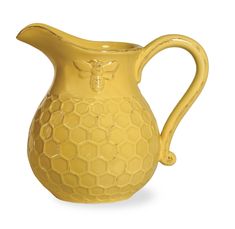 PRICES MAY VARY. CERAMIC PITCHER: Looks beautiful on any table and offers functional style to any kitchen or dining space HOLDS 5 CUPS: Measures 5 inches in diameter and is 6.5 inches tall BEE-INSPIRED: Golden yellow pitcher features embossed honeycomb pattern and bumble bee accent ENTERTAIN IN STYLE: Great for serving guests on special occasions, also lovely for the everyday family dining table CELEBRATE THE HOME: Look for more from the Honeycomb and Save the Bees Collections from Boston Intern Bees Gees, Bee Cottage, Honey Bee Decor, Drink Pitcher, Porcelain Pitcher, Bee Inspired, Bee Decor, Ceramic Pitcher, Honeycomb Pattern