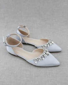 "Embellished pointy toe flats with sparkly row of teardrop rhinestones across toe and detachable ankle strap. Comfort with simplicity perfect for brides and bridesmaids. Details: Colors available: Black, Burgundy, Champagne, Dusty Pink, Hunter Green, Ivory, Light Blue, Navy, Red, Royal Blue, Silver, and White UPPER: Synthetic upper and lining MATERIALS: Manmade outsole Heel height: 0.625\" STYLE NAME: BELLA SIZE FIT: RUNS LARGE, ORDER HALF SIZE DOWN FROM YOUR NORMAL SIZE Not sure of which size t Rhinestone Applique Embellishments, Bridesmaid Shoes Flat, Satin Wedding Shoes, Silver Wedding Shoes, Feminine Shoes, Holiday Shoes, Pointy Toe Flats, Bridesmaid Shoes, Womens Wedding Shoes