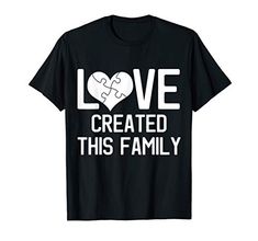 a black t shirt that says love created this family