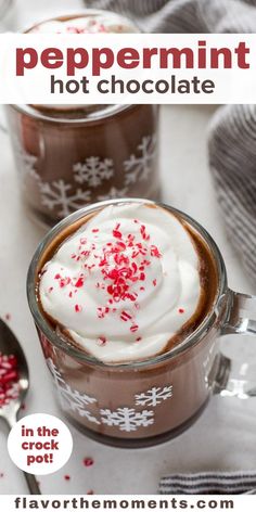 two mugs filled with hot chocolate and whipped cream