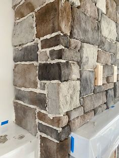 a brick wall is being installed in the bathroom