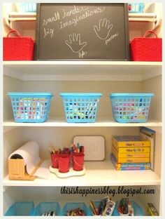 the shelves are filled with books, toys and other things to write on chalkboard