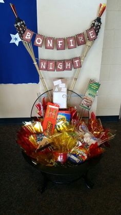 a basket filled with candy and candies on top of a table