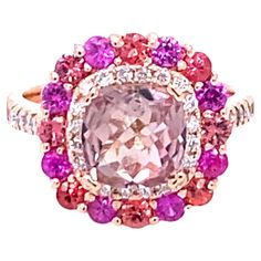 Luxury Pink Multi-stone Sapphire Ring, Pink Multi-stone Sapphire Ring In Fine Jewelry Style, Pink Multi-stone Sapphire Ring, Fine Jewelry, Luxury Pink Multi-stone Ruby Ring, Pink Multi-stone Sapphire Ring, Luxury Multi-stone Pink Gemstones, Luxury Pink Gemstone With Center Stone, Luxury Pink Multi-stone Gemstones, Pink Sapphire Multi-stone Ring With Diamond