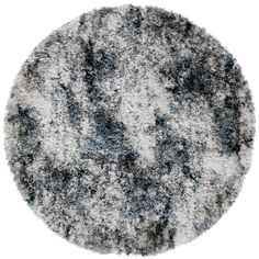 a round rug with grey and white colors