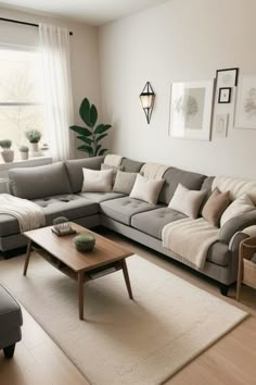 a living room filled with lots of furniture next to a large window on top of a hard wood floor