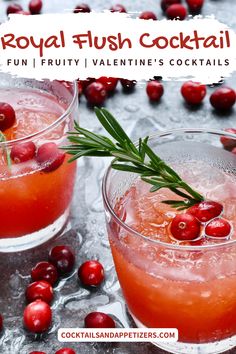 two cocktail glasses filled with cranberry punch and garnished with rosemary sprigs