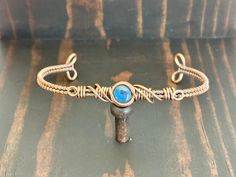 a bracelet with a blue stone on it