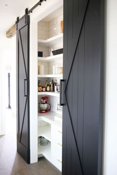 an open barn door in a kitchen