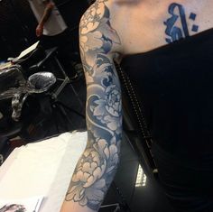 a woman with a tattoo on her arm