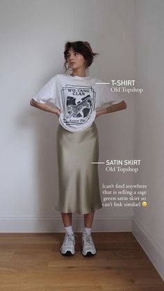 Silk Dress Sneakers Outfit, T Shirt Silk Skirt, Button Up Over Dress Outfit, Silk Skirt And Graphic Tee, Skirts Sneakers Outfit, Midi Skirt Trainers Outfit, Band Tee Street Style, Summer 2023 Outfit Trends, Satin Skirt Outfit Street Styles