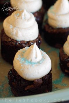 chocolate brownies with white frosting on top