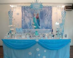 the table is set up for a frozen princess party