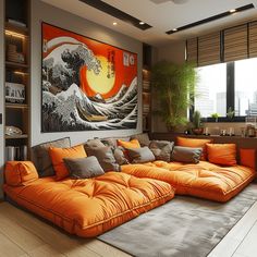 an orange couch sitting in front of a painting on the wall next to a window