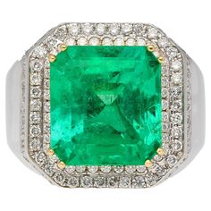 GRS certified 9.54 carat insignificant oil Colombian emerald and diamond mens ring. Featuring a round cut diamond halo and smooth polished 18k gold finish. A noticeably valuable ring with an unmistakably natural emerald. A large face with substantial weight on the finger that elicits a feel of value and luxury. The emerald bears excellent transparency with a vibrant bright green color that occupies the entire gem. A gem of this carat with insignificant oil treatment and Colombian origin is rare. Diamond Mens Ring, Mens Rings For Sale, Large Face, Contemporary Ring, Oil Treatments, Colombian Emeralds, Mens Ring, Diamond Halo, Natural Emerald