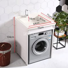 a washer and dryer sitting next to each other in front of a white tiled wall