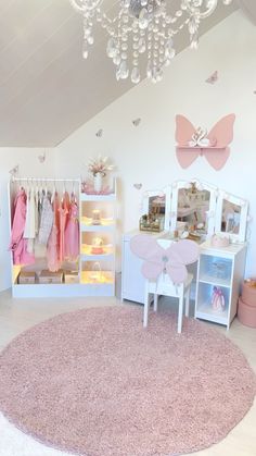 a child's room with pink carpet, white furniture and lots of decorations on the walls