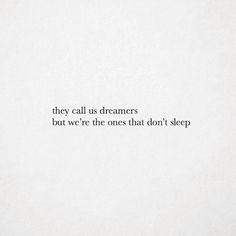 there is a quote on the wall that says they call us dreamers, but we're the ones that don't sleep