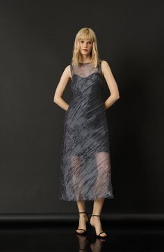 "Find Luxely 2-piece Stream Organza Slipdress on Editorialist. This two-piece dress features a richly textured, sheer organza midi dress paired with an inky slipdress. 52 1/2\" length Organza dress has back keyhole with button-and-loop closure; jewel neck; sleeveless Slipdress slips on over head; V-neck; adjustable straps 100% polyester Dry clean Imported" Spring Night Out Organza Dress, Spring Silk Midi Dress With Sheer Sleeves, Sheer Silk Midi Dress For Formal Occasions, Fitted Midi Dress With Sheer Organza Sleeves, Spring Midi Dress With Sheer Organza Bodice, Formal Sheer Silk Midi Dress, Spring Evening Organza Midi Dress, Elegant Midi-length Mesh Dress, Formal Sheer Organza Midi Dress