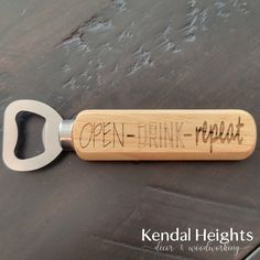 a bottle opener with the words open - drink - repeat written on it and a corkscrew