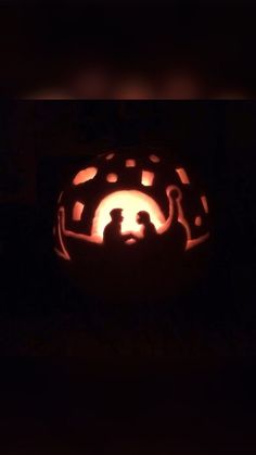 a pumpkin carved to look like it has been carved into the shape of a man and woman