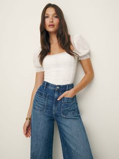 Up top. Shop the Lavena Top from Reformation, a fitted top with a square neckline, puff sleeves, ruching throughout the bodice, and embroidered detailing. Off White Top Outfit, Reformation Outfit Street Styles, Jeans And A Nice Top Casual, Square Neckline Top Outfit, Cute Blouse Tops, Summer Work Tops, Cute White Top Outfits, Soft Summer Romantic Style, Summer Business Casual Tops