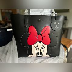 Brand New Large Disney Reversible Mini Kate Spade Tote. Lined In Cream And Polkadot Can Be Worn On Either Side. Brand New With Tags Attached Ships In 24 Hours Excluding Holidays And Weekends. Size Height: 12.68" Width: 6.1" 13.2"W Disney Coach, Disney Tote, Kate Spade Disney, Kate Spade Totes, Bags Purses, Kate Spade Bags, Kate Spade Bag, Kate Spade New York, Womens Tote Bags