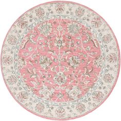 a round rug with an ornate design in pink and white colors on a white background