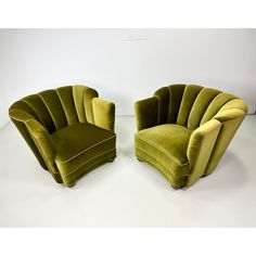 two green chairs sitting next to each other