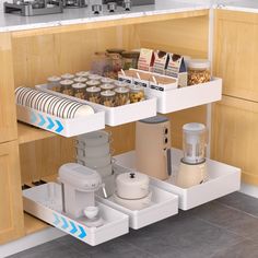 an open drawer in a kitchen filled with food and drink items on the bottom shelf