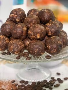 chocolate balls on a glass plate with coffee beans