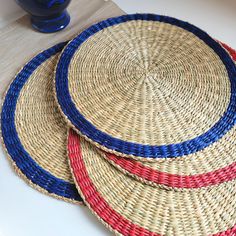 three woven baskets sitting on top of a table