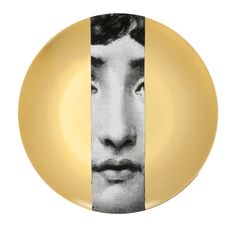 a yellow plate with a black and white image of a man's face on it