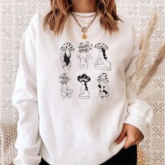 Unisex mushroom girls crewneck sweatshirt for men and women. SIZING * FOR AN OVERSIZED FIT, SELECT 1-2 SIZES UP FROM YOUR NORMAL SIZE * Sizing is unisex so runs like men's, though not overly large * A pre-shrunk, classic fit sweater that's made with air-jet spun yarn for a soft feel and reduced pilling. * Fuzzy fleece, warm lining. Details: * 50% cotton, 50% polyester * Pre-shrunk * Classic fit * 1x1 athletic rib knit collar with spandex * Air-jet spun yarn with a soft feel and reduced pilling Relaxed Fit Fall Tops With Mushroom Print, Relaxed Fit Mushroom Print Top For Fall, Relaxed Fit Top With Mushroom Print For Fall, Cotton Sweatshirt With Mushroom Print, Casual Crew Neck Sweatshirt With Mushroom Print, Cotton Crew Neck Sweatshirt With Mushroom Print, Winter Cotton Tops With Mushroom Print, Cotton Long Sleeve Sweatshirt With Mushroom Print, Casual Long Sleeve Top With Mushroom Design