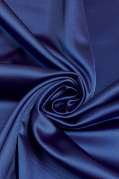 Navy Italian Stretch Satin Fabric is a gorgeous satin that is elegant and lustrous, this Italian satin is so smooth and made with the finest quality. This Italian Stretch Satin is ideal for alluring evening gowns, mermaid dresses, blouses, luxurious lingerie or smart, lightweight jackets. Purchase high-quality Navy Italian Stretch Satin Fabric by the Yard at NY Designer Fabrics. The fabric measures 48/50 inches in width. Solid Color Satin Finish Party Dress, Solid Color Satin Dress For Party, Solid Color Bias Cut Satin Dress For Evening, Formal Solid Color Satin Dress, Elegant Stretch Satin Dress For Formal Occasions, Formal Silk Satin Dress, Stretch Satin Fabric, Stretch Satin, Mermaid Dresses