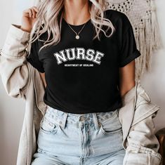 🌟 Welcome to Comzy Closet! 🌟 Do you like this "Nurse: Heartbeat of Healing" t-shirt?  We are working hard, to get the best tees in town for YOU! Support our small business and buy our cozy t-shirts! You won't regret!  Step into a world of your unique style add a touch of individuality to your wardrobe with our collection of custom design printed tees!  🎨 Express Yourself: From vibrant graphics to intricate patterns, our designs are crafted to ignite your imagination and make a statement where Cotton Nursing T-shirt Relaxed Fit, Relaxed Fit Cotton T-shirt For Nursing, Cotton Relaxed Fit T-shirt For Nursing, Relaxed Fit Cotton Nursing T-shirt, Casual Nursing Shirt With Short Sleeves, Casual Short Sleeve Nursing Shirt, Casual Cotton T-shirt For Nursing, Casual Relaxed Fit Nursing T-shirt, Nursing Graphic Tee With Short Sleeves