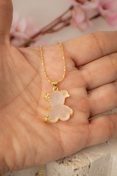 Delicate and playful, this rhodium-plated necklace features an adorable teddy bear pendant. Perfect for adding a sweet touch to any outfit, its detailed design shines in any light, making it an instant favorite. Colombian Gold, Miyuki Ring, Teddy Bear Pendant, Bronze Earrings, Gold Anklet, Energy Bracelets, Bear Pendant, Detailed Design, Bracelet Collection