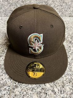 mariners mocha fitted hat. Pre order in hand a year long wait Brown Fitted Baseball Cap, Brown Flat Brim Hat For Baseball Season, New Era 59fifty, Fitted Hat, Fitted Hats, Mocha, A Year, New Era, Pre Order