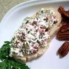 a white plate topped with food and pecans