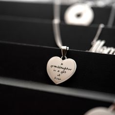 Celebrate the precious bond between a granddaughter and her grandparents with this beautiful heart pendant necklace from Joyful Sentiments. Exquisitely crafted in Stainless Steel, the pendant features the heartfelt engraving "A Granddaughter is a Gift of Love" accented with a shimmering cubic zirconia stone set in the center of the letter "O". The pendant hangs gracefully from an 18 inch Stainless Steel chain with a 3 inch extender, allowing you to adjust the length for the perfect fit. Stainles Mother's Day Heart Pendant Necklace In Stainless Steel, Mother's Day Stainless Steel Necklace For Mom, Mother's Day Stainless Steel Heart Pendant Necklace, Mother's Day Gift Stainless Steel Necklace, Stainless Steel Heart Pendant Necklace For Mother's Day, Personalized Stainless Steel Heart Necklace For Mother's Day, Valentine's Day Stainless Steel Necklace Gift For Mom, Valentine's Day Gift For Mom: Stainless Steel Necklaces, Stainless Steel Necklaces For Mom On Valentine's Day