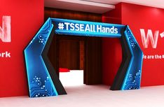 a red wall with a blue sign that says tseeall hands and we are the new york