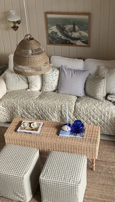 a living room filled with lots of furniture and decor on top of carpeted flooring