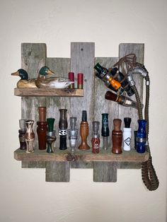 a wooden shelf filled with different types of bottles