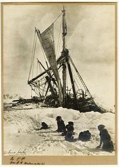 an old black and white photo of people in the snow with a boat on top of it