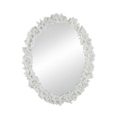 a round mirror with white flowers on the edges and a flowery border around it