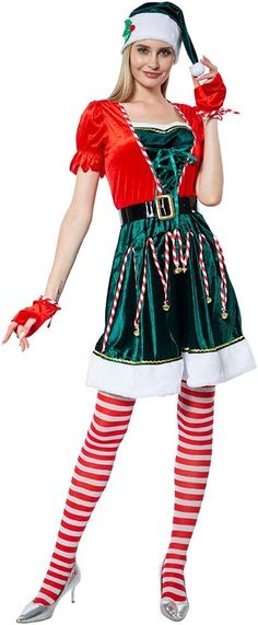 a woman dressed as santa clause holding candy canes