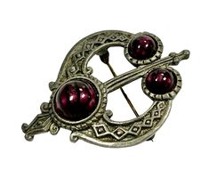 "Pretty Celtic style brooch made in pewter and purple glass cabochons. Dimensions: It measures 5x3.7cm (1.96\"x1.46\"). Weight: 13.7 grams. It fastens with a rollover clasp. In wonderful vintage condition. ------------------------------------------------- * Thank you very much for visiting our Etsy store!  We will be delighted to combine and refund any excess postage for multiple items bought. If you have any questions, please do not hesitate to contact me." Antique Metal Brooch For Formal Occasions, Gothic Formal Jewelry Brooch, Art Nouveau Cabochon Wedding Brooches, Collectible Silver Metal Brooches, Silver Cabochon Brooches Collectible, Antique Silver Metal Brooch, Celtic Brooch, Scottish Broch Iron Age, Silver Art Nouveau Brooches For Gifts