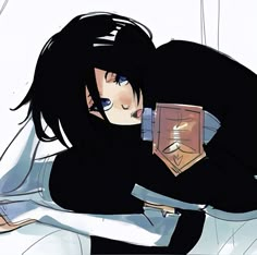 a woman laying on top of a bed holding a book