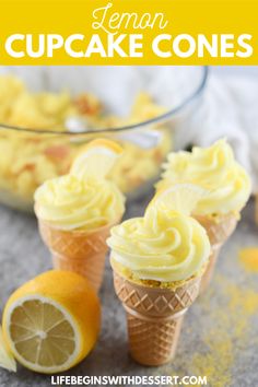 lemon cupcake cones with frosting on top and an orange slice next to them