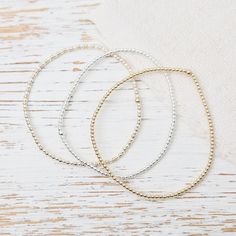 Whether worn alone for a touch of understated luxury or stacked with other bracelets for a bold statement, these Ball Bead Bracelets add a touch of glamour to any outfit, for any occasion. Made to be worn in the pool, shower, ocean, or wherever your bohemian adventures take you. Waterproof | Tarnish Free | Hypoallergenic Classic 2mm beads Options: 14K gold filled, Sterling Silver, or Two Tone High Performance Elastic Made in Miami Stackable Metal Beaded Bracelets For Party, Metal Stackable Beaded Bracelets For Party, Gold Bracelets With Tiny Beads For Party, Gold Bracelet With Tiny Beads For Party, Dainty Metal Beaded Bracelets For Party, Gold Bracelets For Party, Everyday Stretch Bracelet With Faceted Beads, Minimalist Round Bead Bracelets For Party, Elegant Stretch Bracelet With Faceted Beads